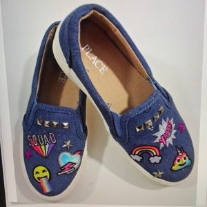Children’s shoes size 13 embroidered with emoji.
